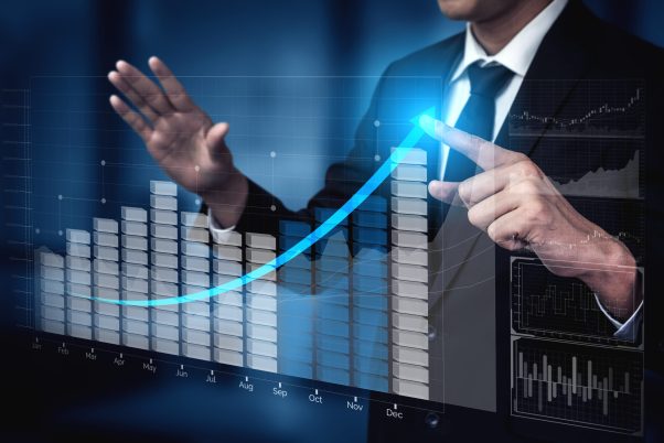 Double Exposure Image of Business and Finance - Businessman with report chart up forward to financial profit growth of stock market investment.