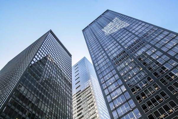 Modern glass skycraper with sunlight